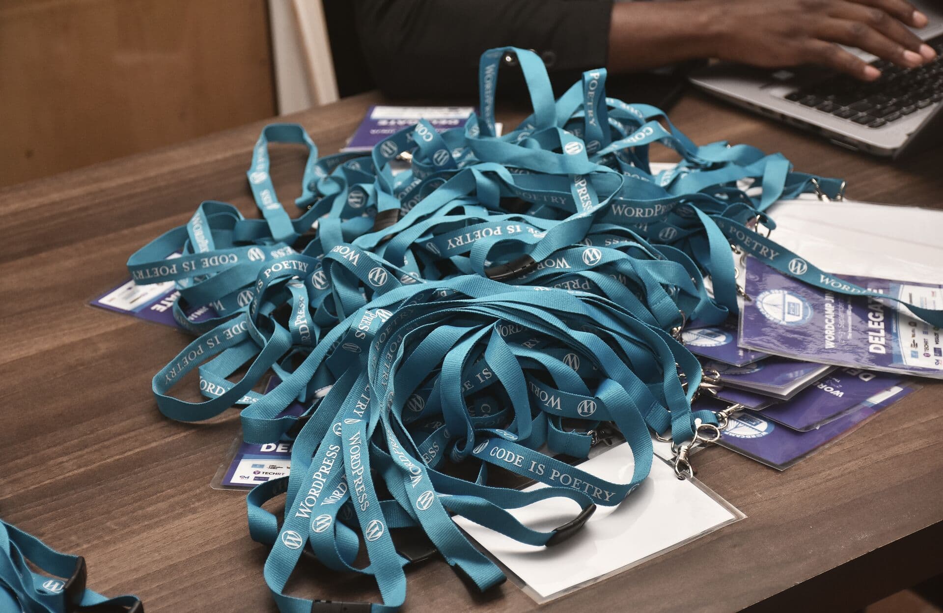 Lanyards and badges ready on the registration desk
